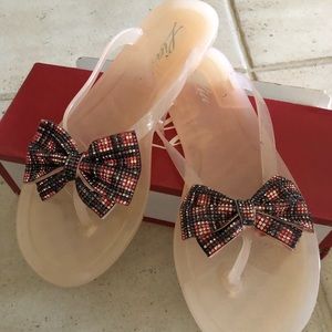 Clear pink, with sparkle bow detail size 10